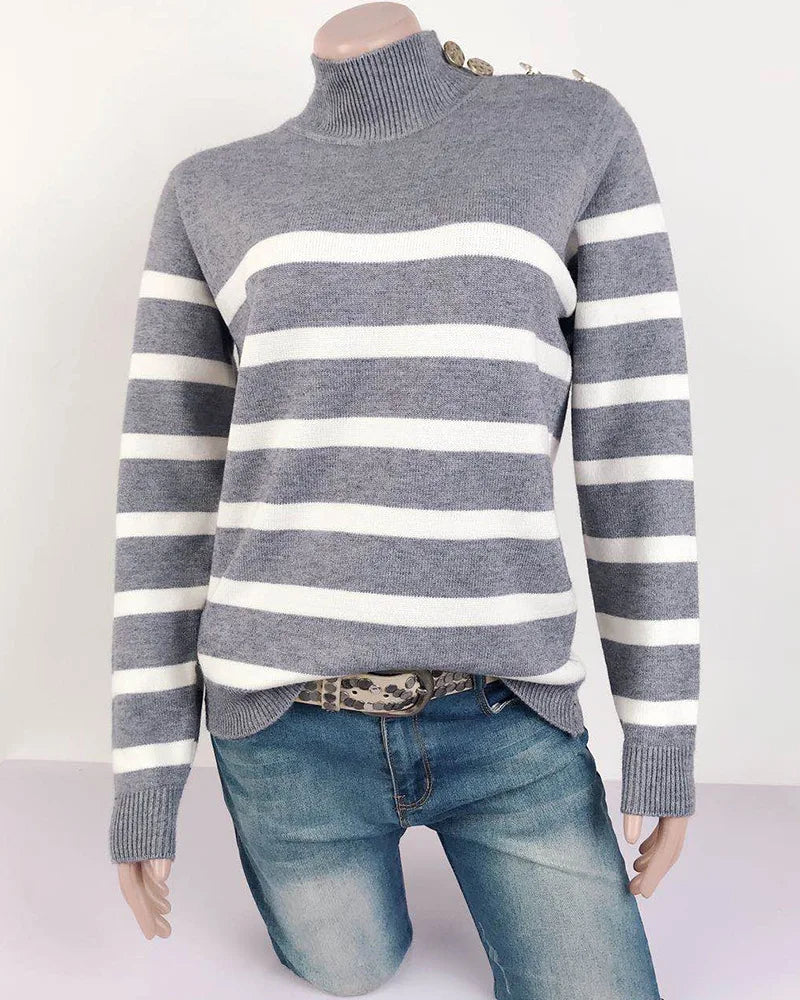 Gray and white striped sweater worn by a mannequin on a white background