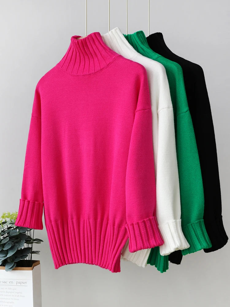 Four sweaters in pink, white, green, and black on a light gray background.