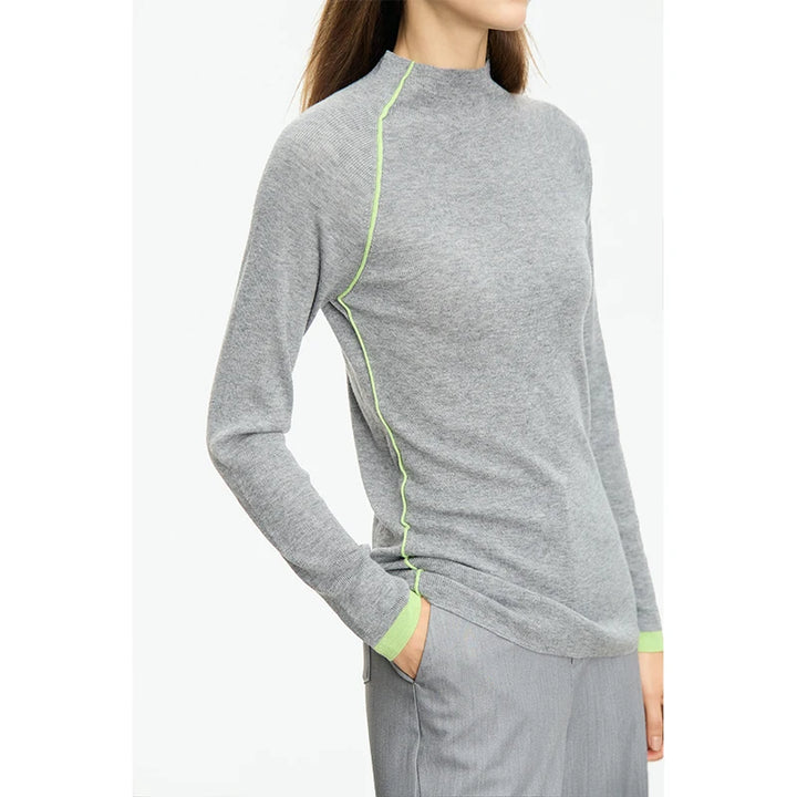 Gray long-sleeve top with green accents on a white background