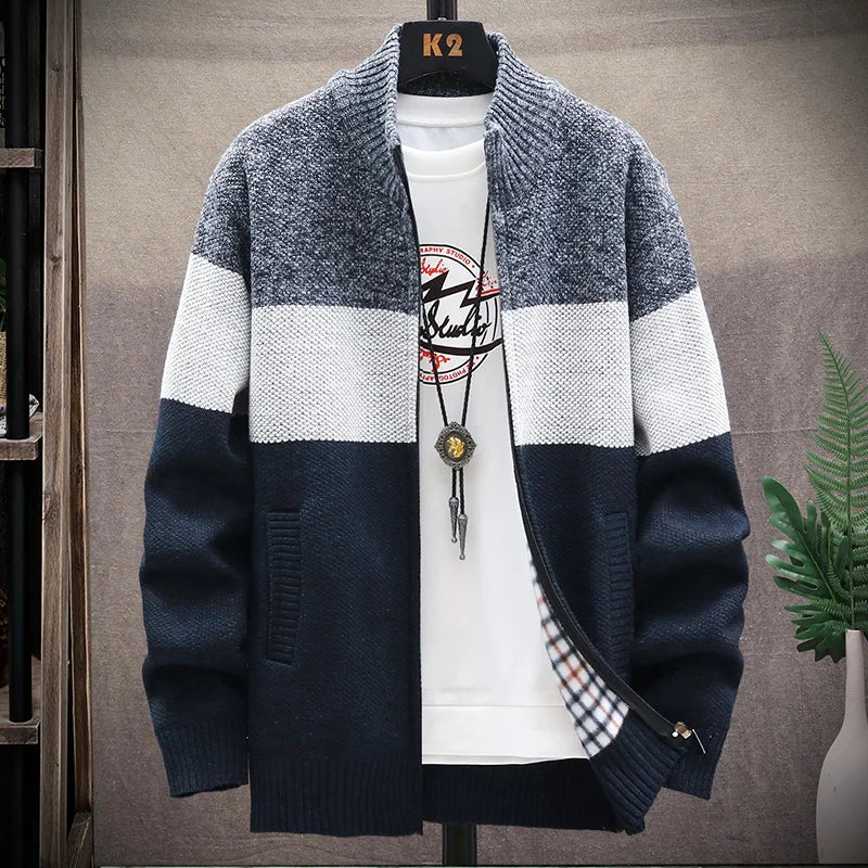 Navy and gray striped sweater on a mannequin against a neutral background