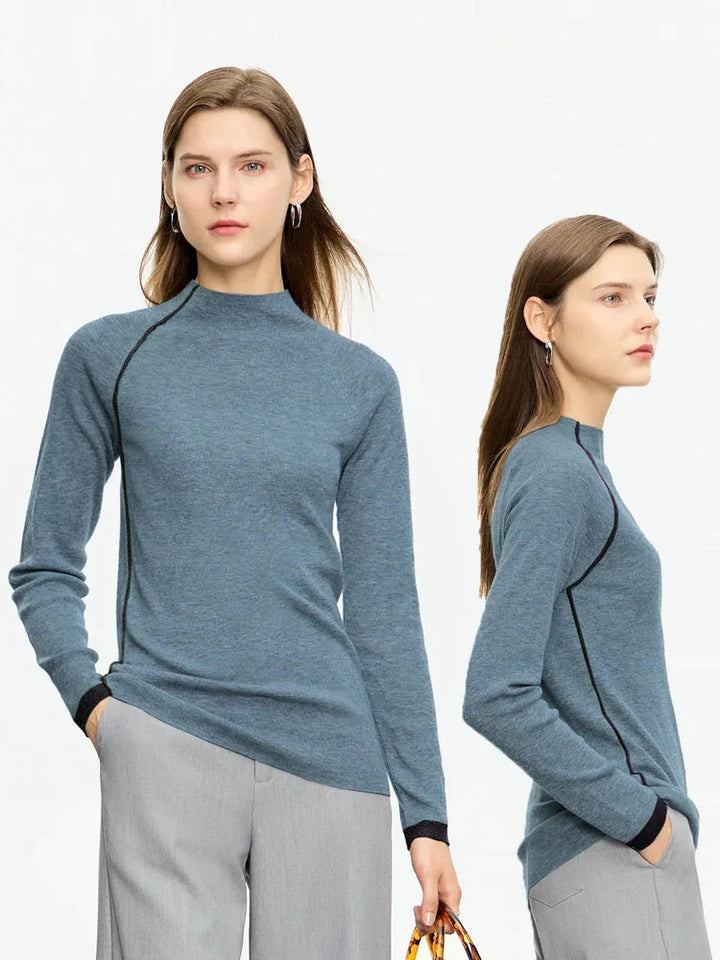 Woman wearing a blue sweater with black trim, shown from front and side views on a white background.